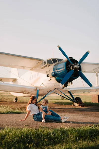 Mom and daughter have fun at the airport