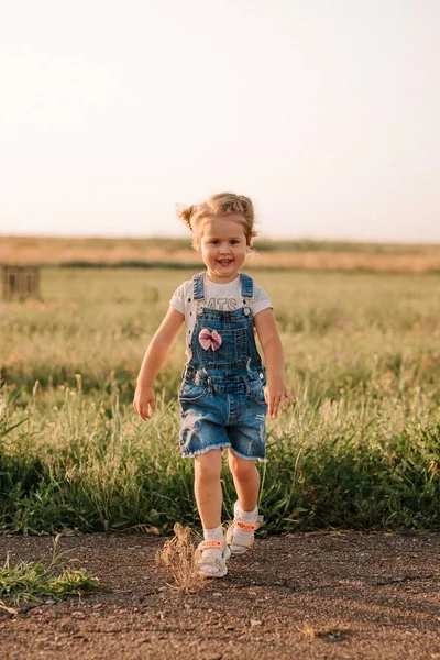 Girl play at the airport in front of a huge airplane