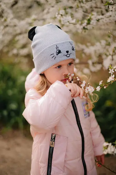Girl in white blooming trees