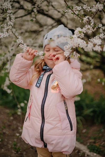 Girl in white blooming trees