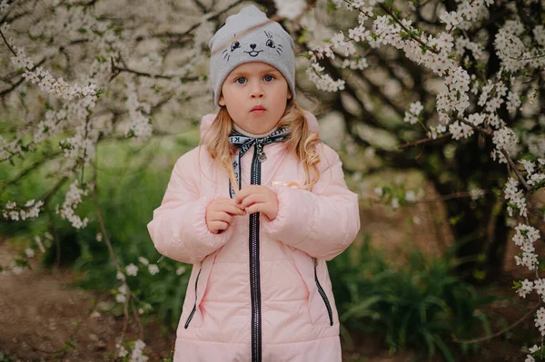 Girl in white blooming trees