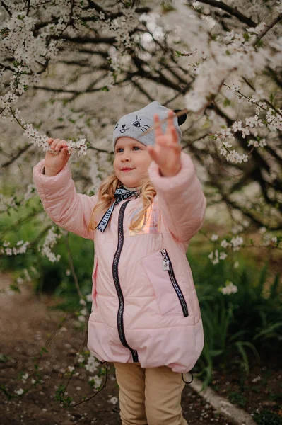 Girl in white blooming trees