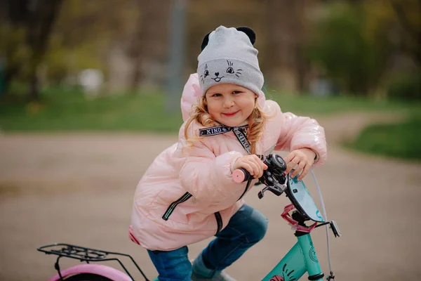 Girl with her first bicycle