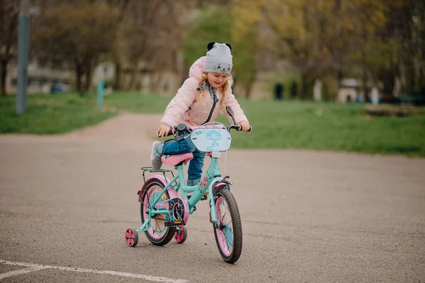 Girl with her first bicycle