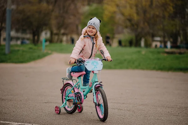 Girl with her first bicycle