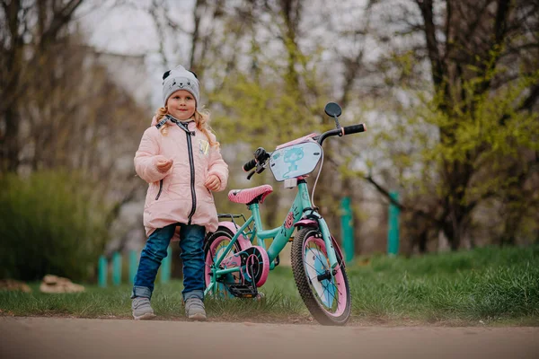 Girl with her first bicycle