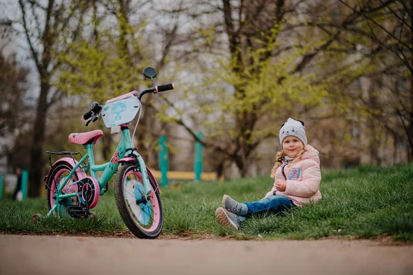 Girl with her first bicycle
