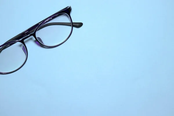Dark frame Eyeglasses on blue background