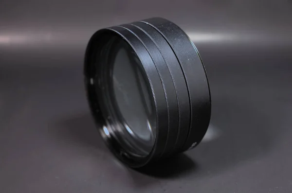 Four Close Lens Filter Attached Together Set Black Background — Fotografia de Stock