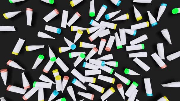 Scattered Colorful Plastic Tubes Black Surface Wiped Create Space Text — Vídeo de stock