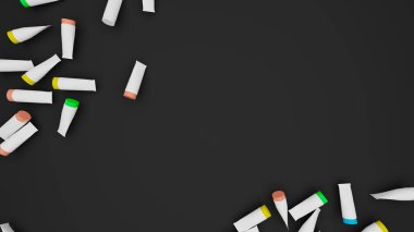 Siyah yüzeye dağılmış renkli plastik borular yazı, ürün vs. için yer açmak için silinmiş. 3 Boyutlu Hazırlama.
