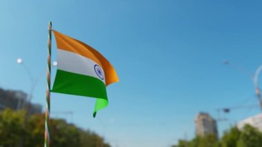 Indian Tricolor Flag on pole waving in heavy wind.
