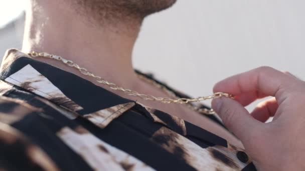 Gold pendant on a man close-up — Stock Video