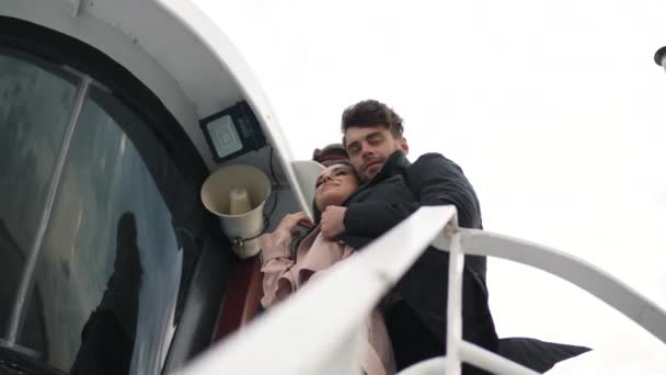 Couple hugging on a yacht in cloudy weather — Stock Video