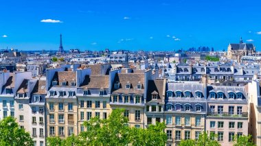 Paris, typical buildings and roofs in the Marais, aerial view from the Pompidou Center, with the Eiffel Tower in background clipart