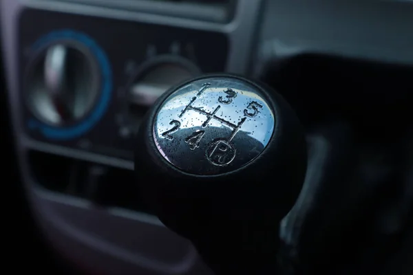 A shift gear knob inside of a vehicle