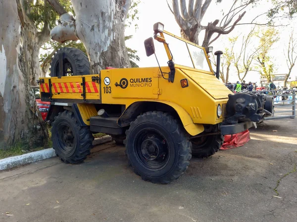 Old yellow utility Mercedes Benz Freightliner Unimog 411 off road truck equipped with winch 1950s. Classic car show.