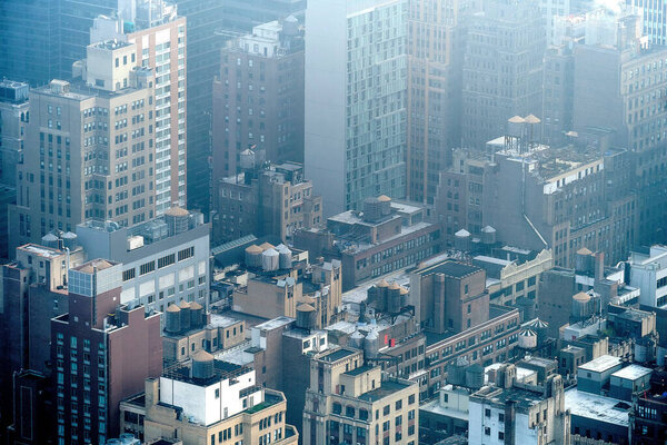 An aerial shot of the skyscrapers of Manhattan in New York, USA on a foggy day