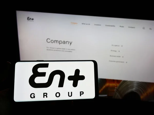 Person Holding Smartphone Logo Anglo Russian Company Enplus Group Plc — Stock Photo, Image