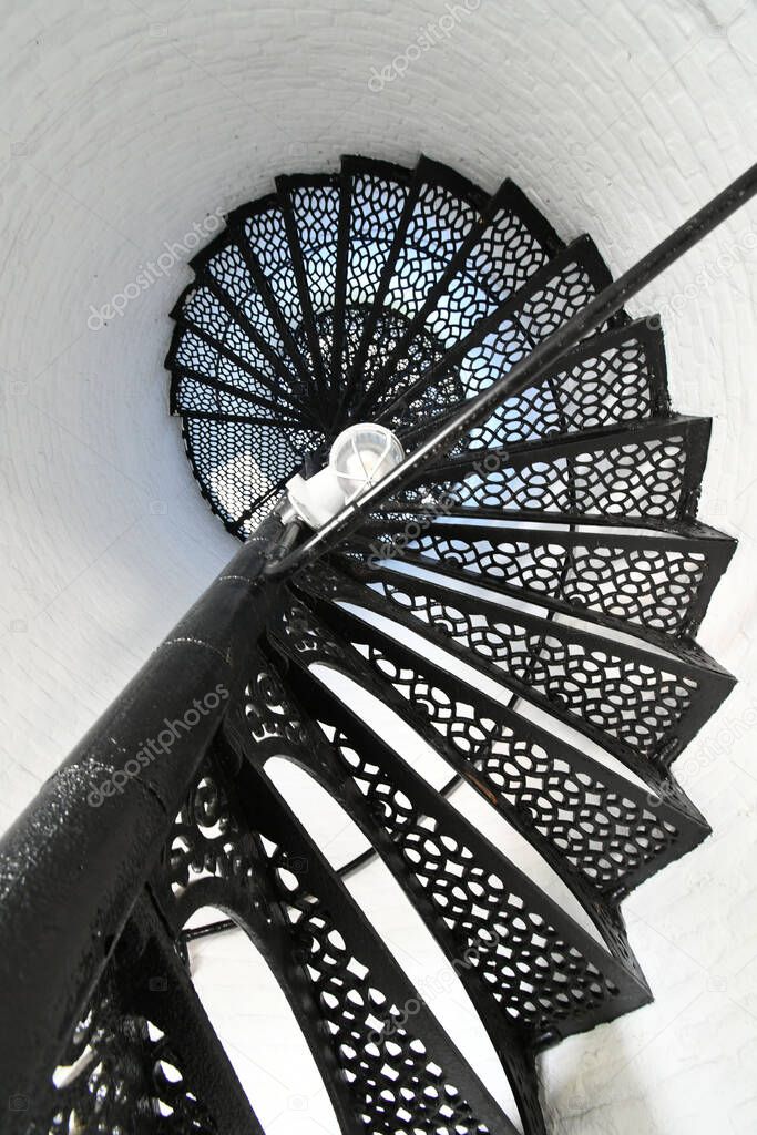 A vertical top view of a black cast iron staircase in the Erie Land Light House, Pennsylvania