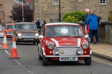 The red classic Mini Cooper during Morpeth Fair Day, Northumberland, UK clipart