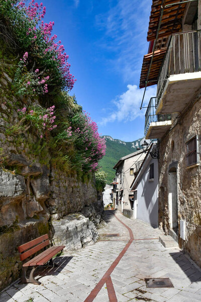 A narrow street between the old houses of Petina, a village in the mountains of Campania region, Italy.