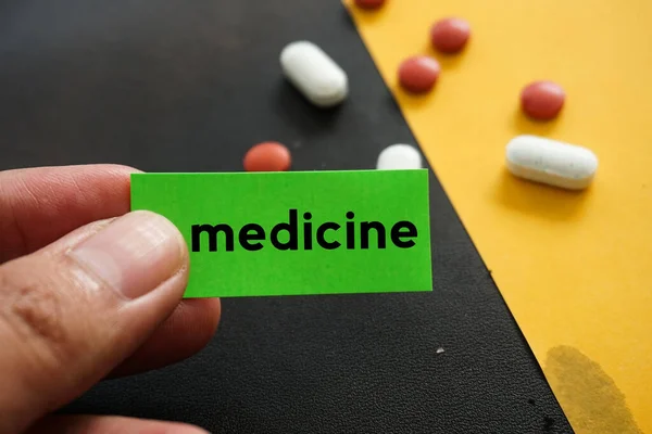 Closeup Shot Medicine Text Green Paper Medical Pills Blurred Background — Stock Photo, Image