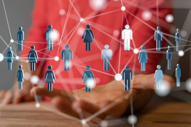 Bir adamın elinde gezinen insan figürlerinin olduğu soyut bir ağ.