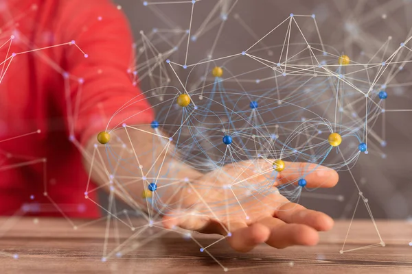 Bir adamın elinde dolanan soyut bir ağ.