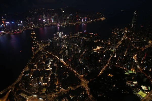 A bird\'s eye view of the Victoria harbor, Central in Hong Kong at nighttime