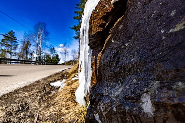 Closeup Shot Frozen Icicles Side Rock Road — Stock Photo, Image