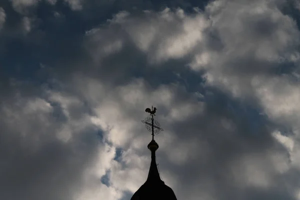 a tower of a church with cloudy background