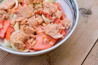 tomato salad with tuna, Greek salad, Mediterranean diet. Tomato, tuna, cucumber, red pepper, onion and virgin pure olive oil. clipart
