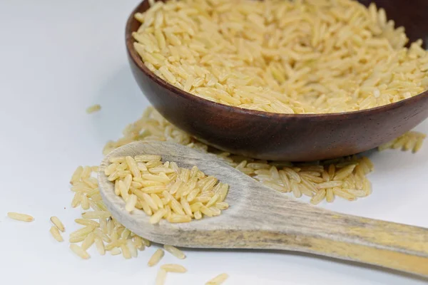 In brown rice, only the inedible husk is removed, while the bran layer and cereal germ are intact, giving it texture and color.