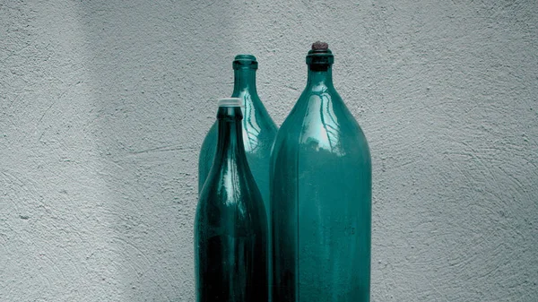 Three Empty Green Bottles White Wall Background — Stock Photo, Image