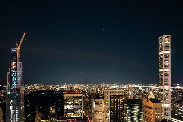 A bird's eye view of the cityscape of New York City, USA at night