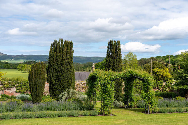 Cottage garden view at Lilburn Tower, near. Wooler, Northumberland, UK, a mansion house gardens open through the National Gardens Scheme.