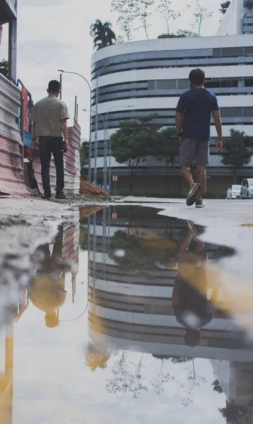 Reflections People Buildings Puddle — Stock Photo, Image