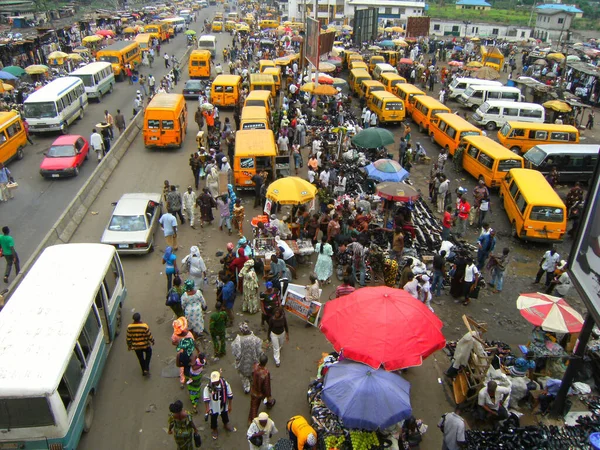 An aerial view of a crowd gathered at a bus station in Lagos, Nigeria