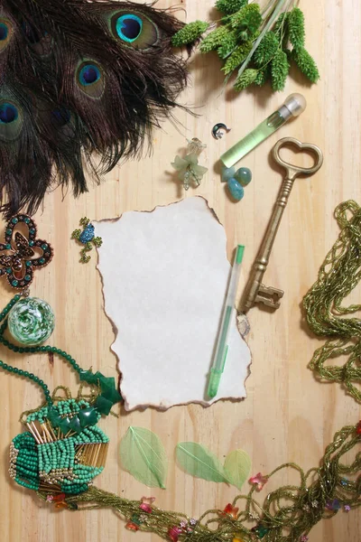 Vintage Burned Paper Antique Key Surrounded Green Jewelry Peacock Feathers — Stock Photo, Image