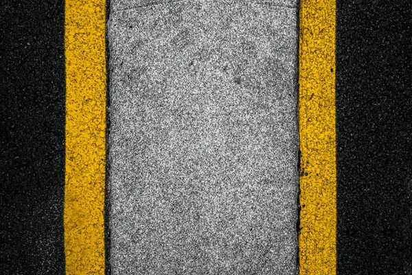 stock image A top view of the freshly painted asphalt with double yellow street lines on the corners