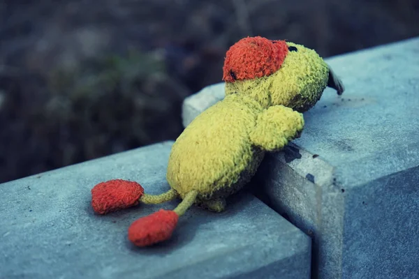 Shallow Focus Shot Rusty Dug Dull Toy Laying Stone Fence — Stock Photo, Image