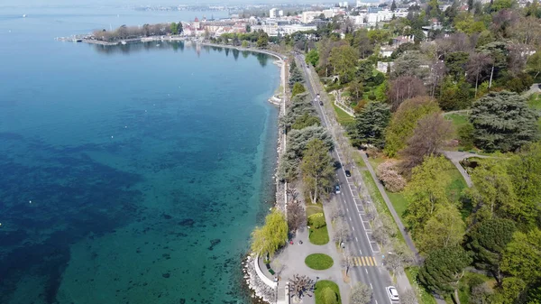 A bird\'s eye view of the Denantou Park against the blue sea in Lausanne, Switzerland