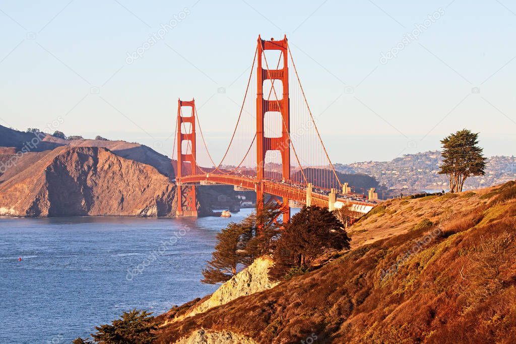 An aerial shot of the Golden Gate Bridge in San Francisco with a lot of traffic on it