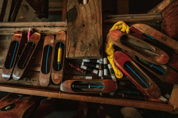 The handicraft wooden weaving shuttle for silk textile production in Santiago