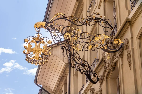 A sign of a restaurant on the facade of a historical building in downtown Bern, Switzerland