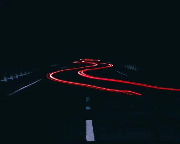 Eine Kurvenreiche Autolichterspur Der Dunkelheit — Stockfoto