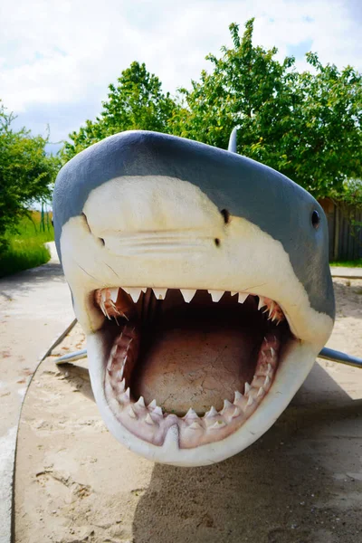 A white shark model with an open mouth in the Park Wieloryba