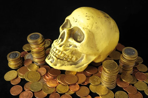 Death and Money Concept Skull and Currency over a Black Background