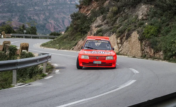 rally car running in the asphalt. Peugeot 205 Maxi